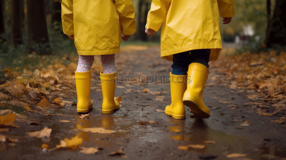 Similar – Rubber boots in the mud