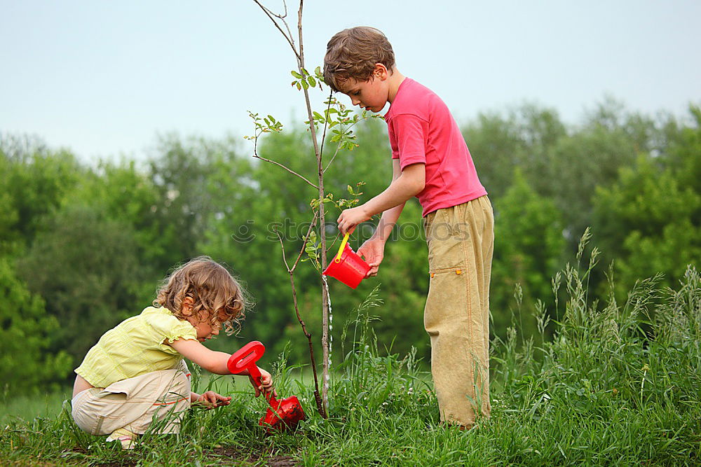 Similar – Image, Stock Photo Boy and girl picking up garbage from ground