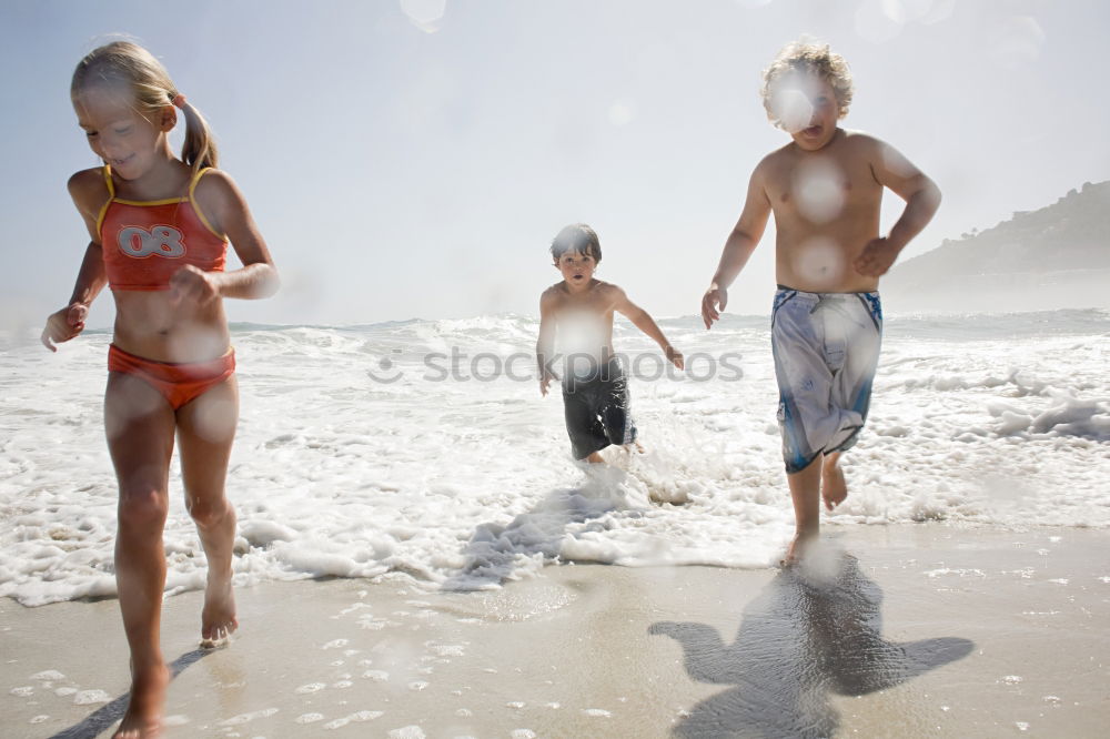 Similar – Image, Stock Photo caucasian mother and son playing with windmill at the beach