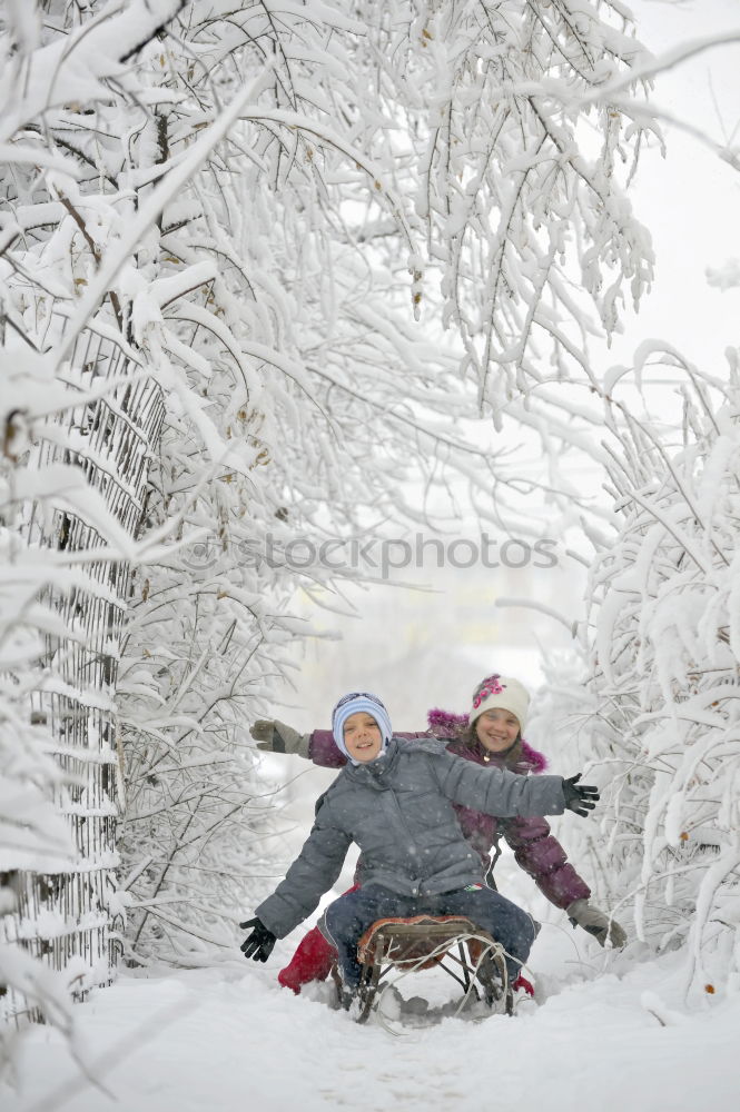 Similar – Mother is playing with her little daughter outdoors in winter