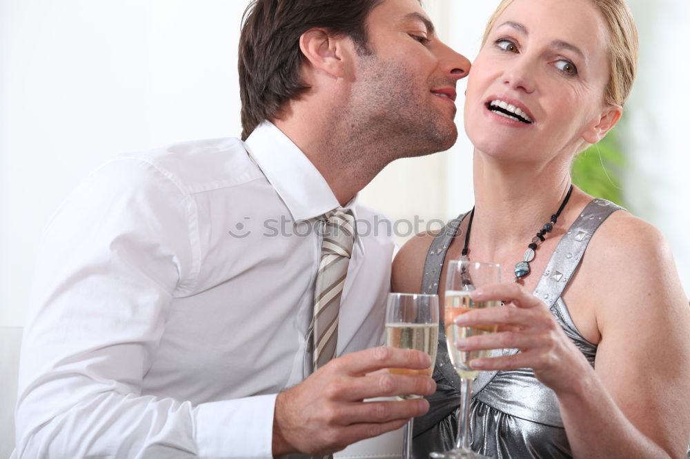 Similar – Image, Stock Photo Bride and groom enjoy a quiet moment together and a drink of white wine at their wedding reception