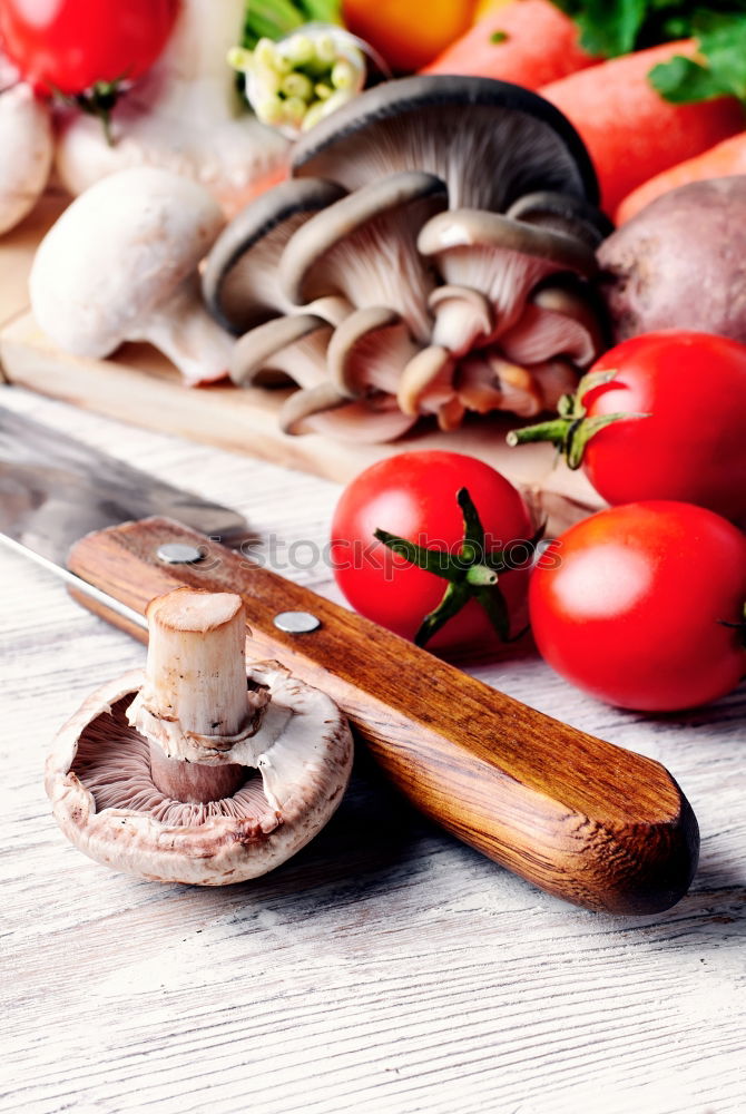 Similar – Image, Stock Photo Sliced mushrooms on cutting board with kitchen knife