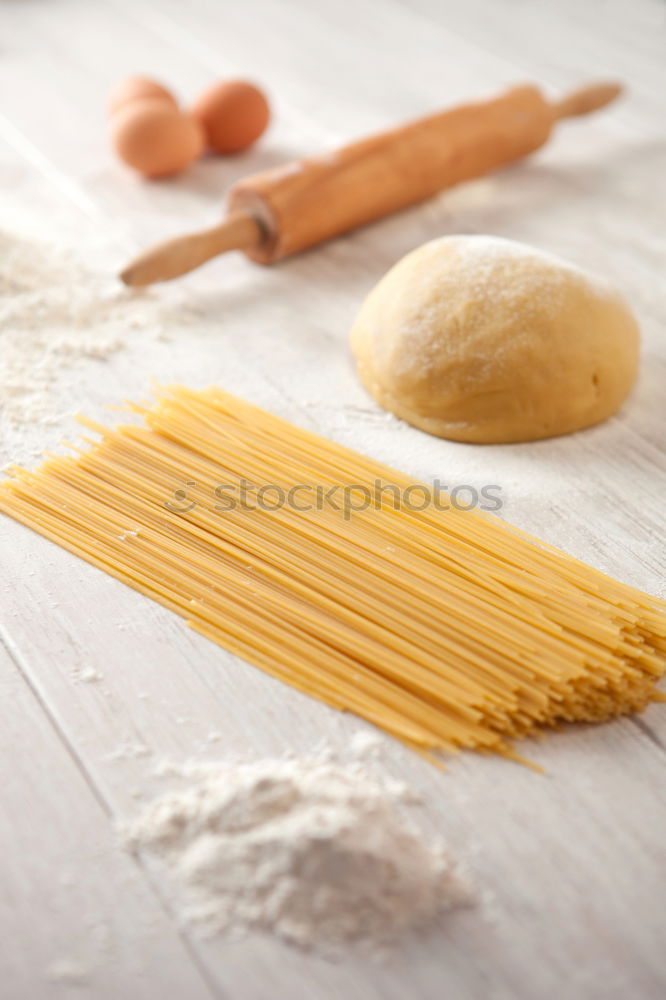 Similar – Image, Stock Photo Making homemade taglatelle with a pasta rolling cutter