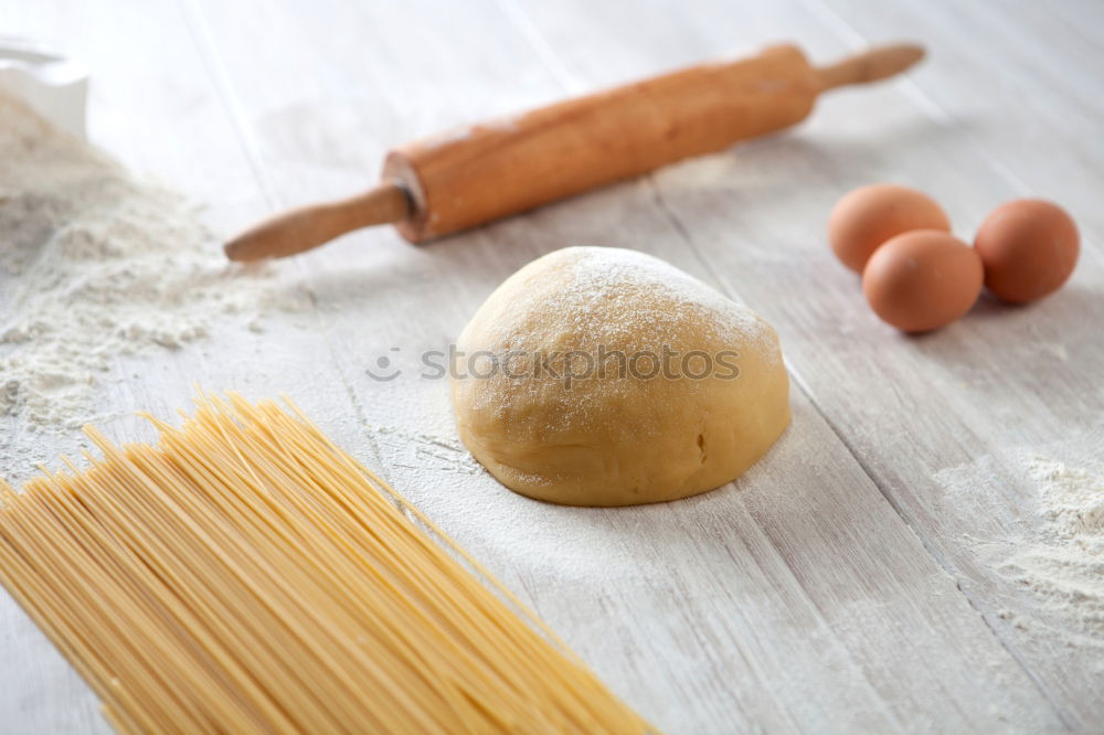 Similar – Image, Stock Photo Making homemade taglatelle with a pasta rolling cutter