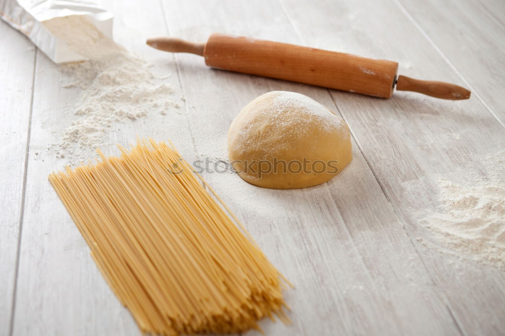 Image, Stock Photo Making homemade taglatelle with a pasta rolling cutter