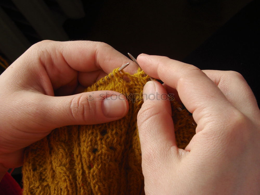 Similar – Close up of the hands of an elderly woman knitting sock