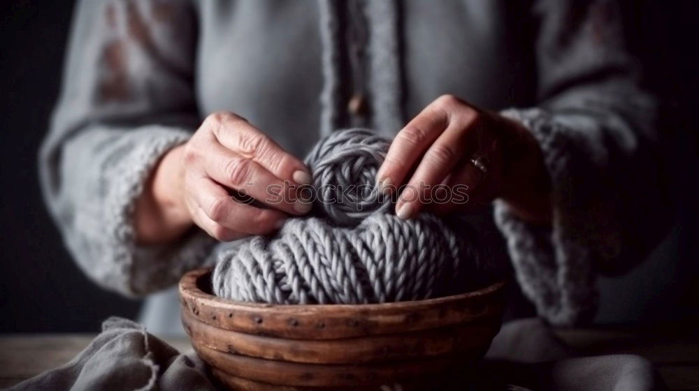 Similar – Close up of the hands of an elderly woman knitting sock