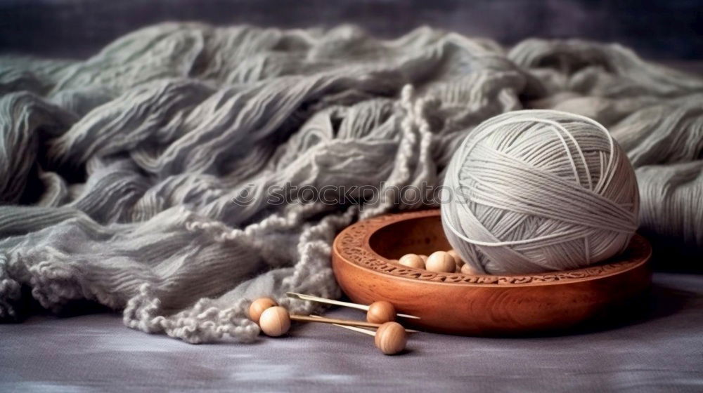 Similar – three historical yarn spindles made of wood with different yarns