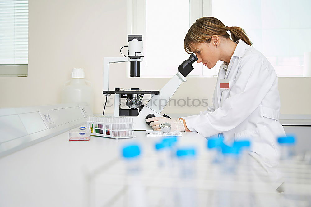 Similar – Image, Stock Photo Woman looking at microscope