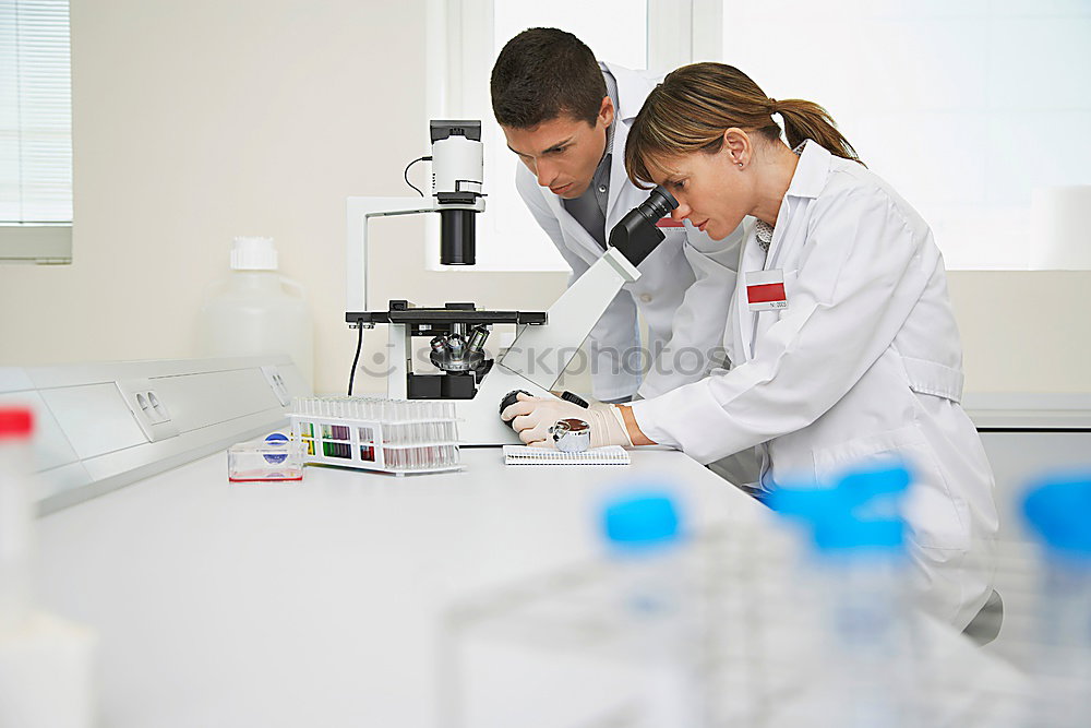 Similar – Image, Stock Photo Woman holding flask in lab
