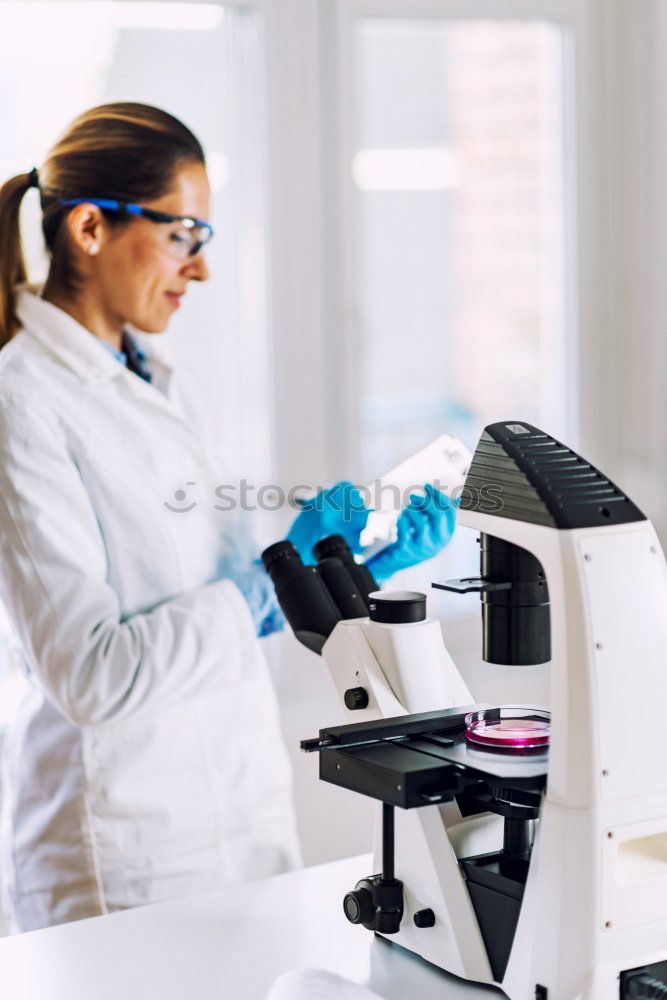Similar – Image, Stock Photo Woman writing on test tube