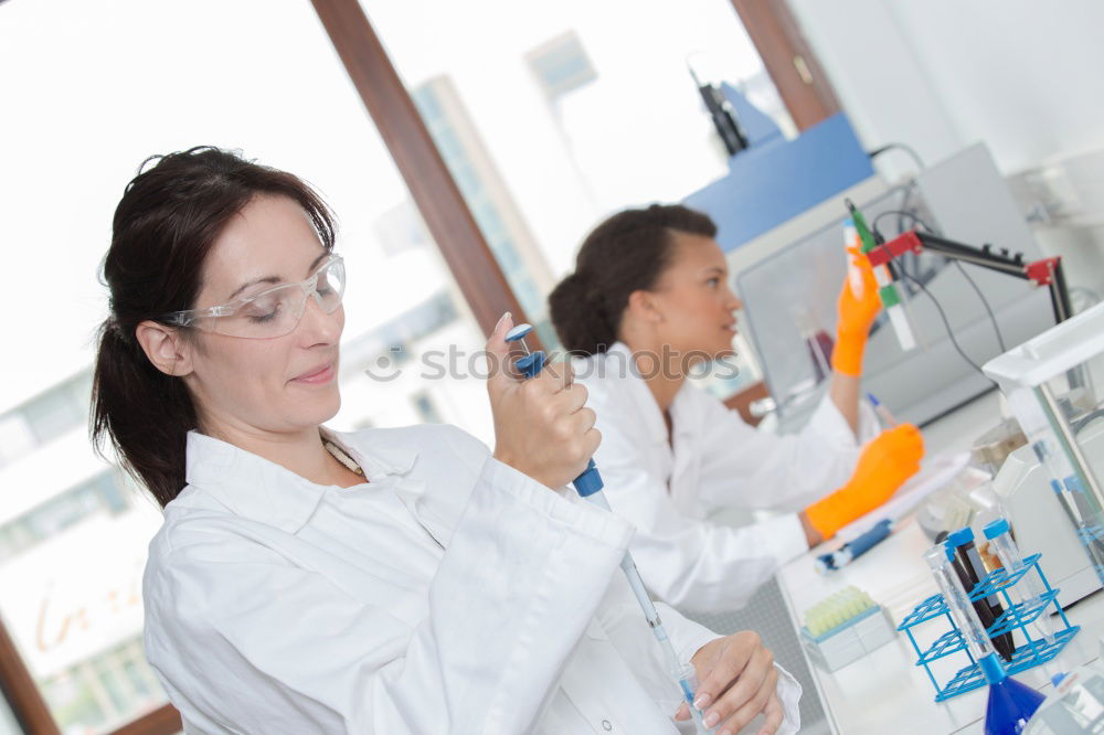 Similar – Image, Stock Photo Woman looking at test tube