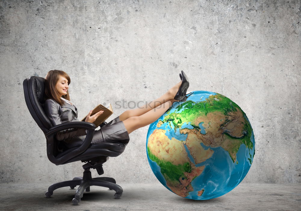 Girl sitting by the map in classroom