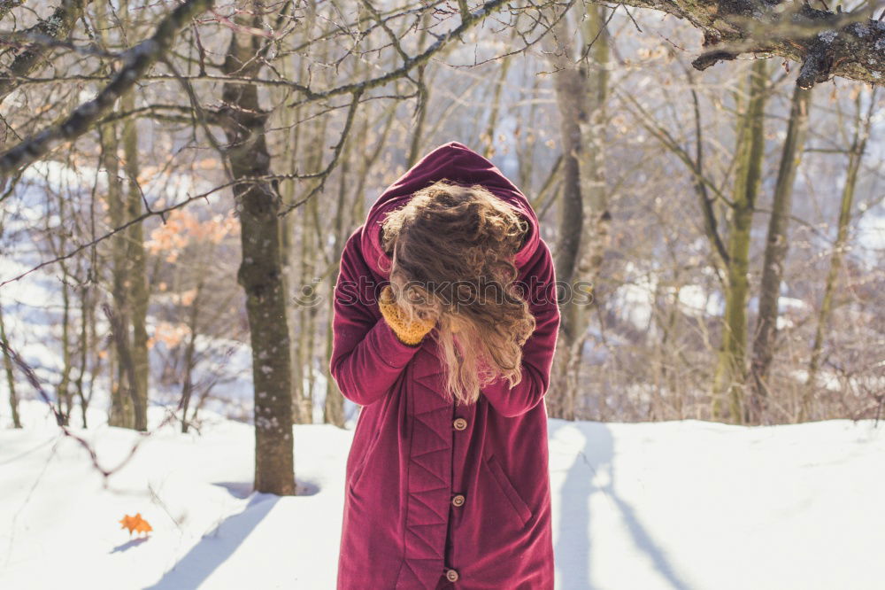 Similar – Young blonde woman lost in a snowy forest