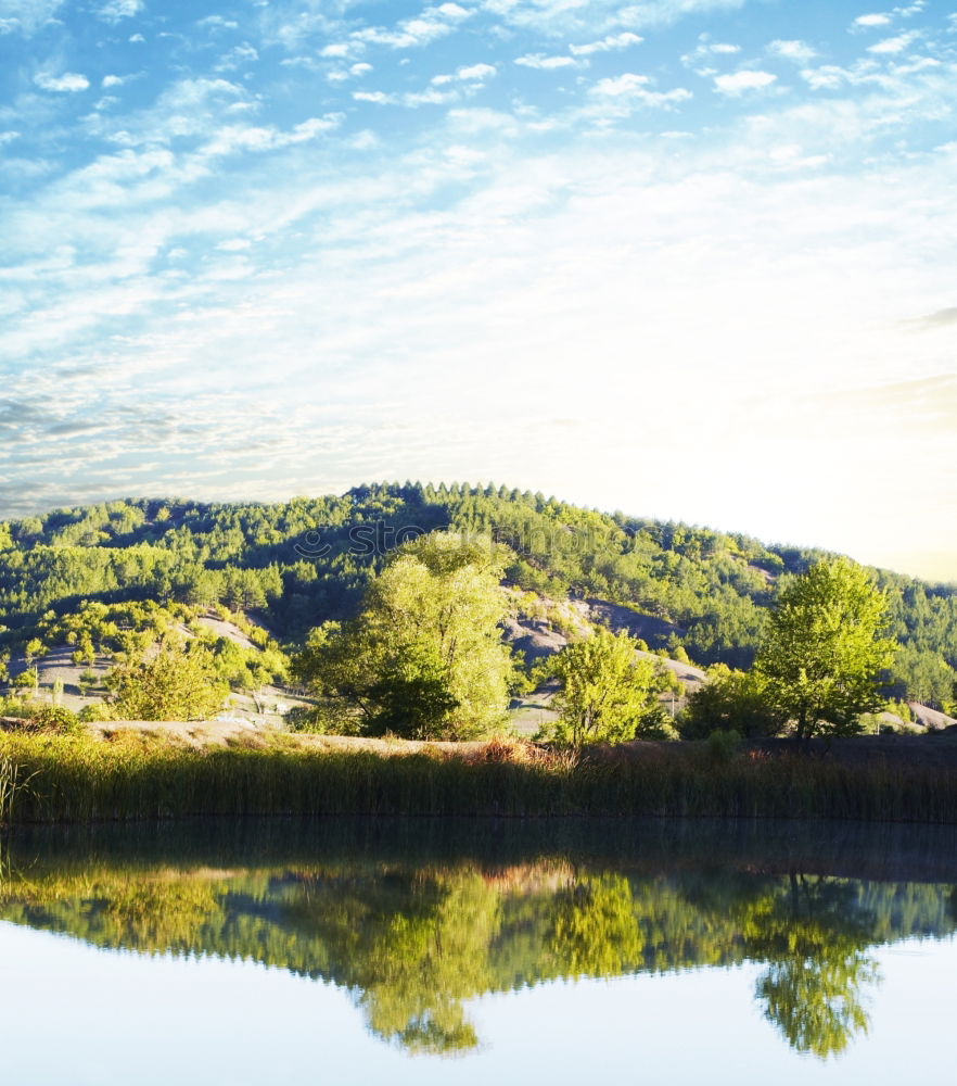 Similar – Lake in sunny mountains