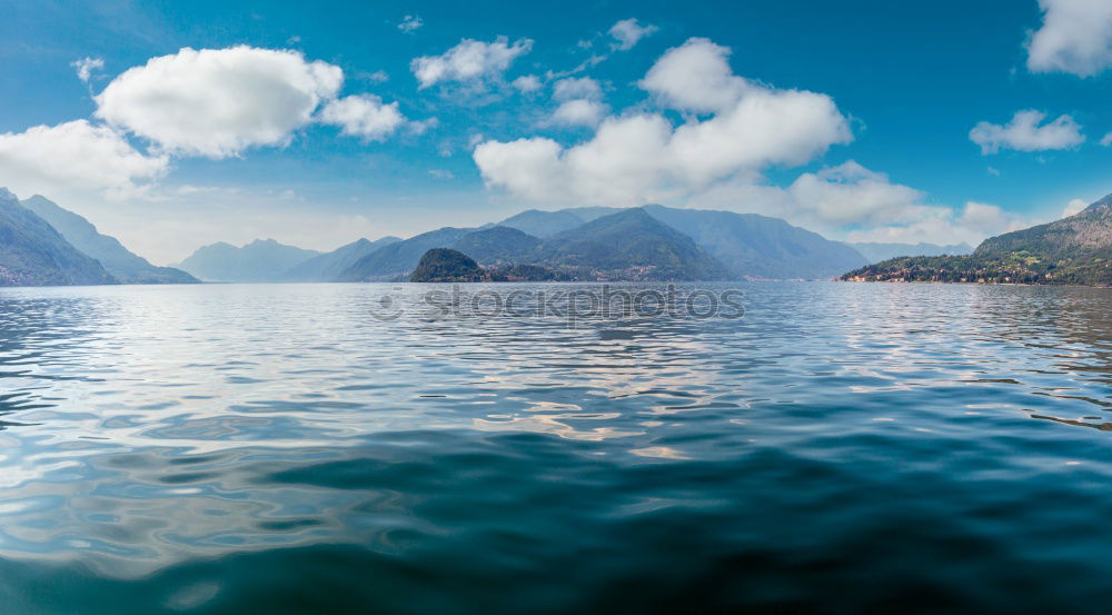 Similar – Image, Stock Photo Mountain landscape with a lot of kite surfers and windsurfers moving in a lake. They use the wind to move their boards on the water. Mountains are as background in a sunny day.