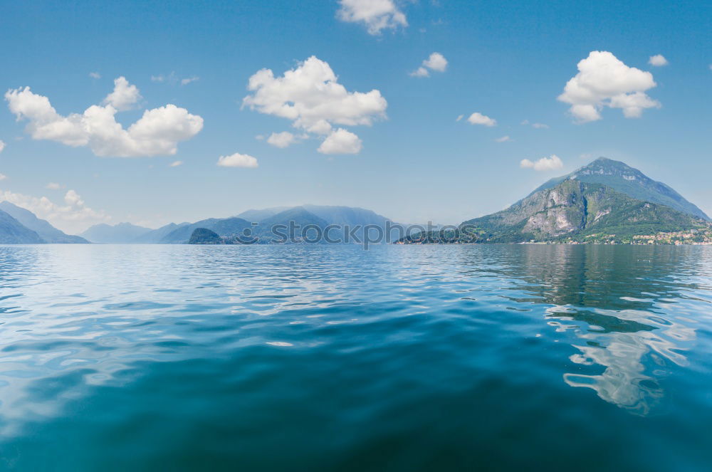 Similar – Image, Stock Photo Mountain landscape with a lot of kite surfers and windsurfers moving in a lake. They use the wind to move their boards on the water. Mountains are as background in a sunny day.