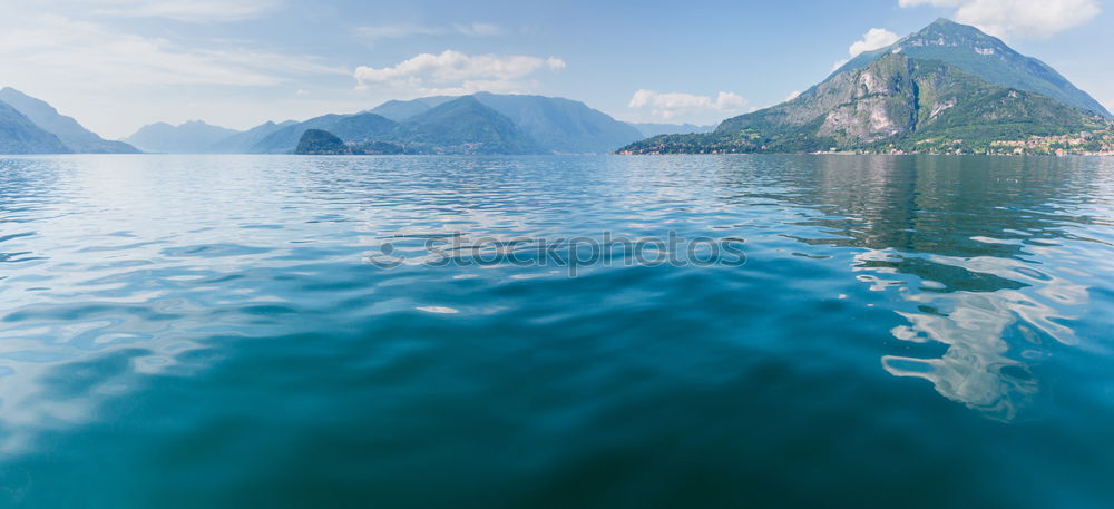 Similar – Image, Stock Photo Mountain landscape with a lot of kite surfers and windsurfers moving in a lake. They use the wind to move their boards on the water. Mountains are as background in a sunny day.