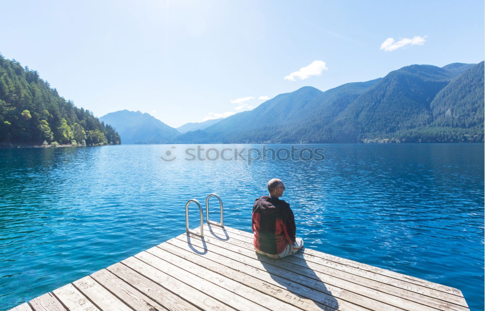 Similar – Image, Stock Photo Woman on a deck over an alpine lake