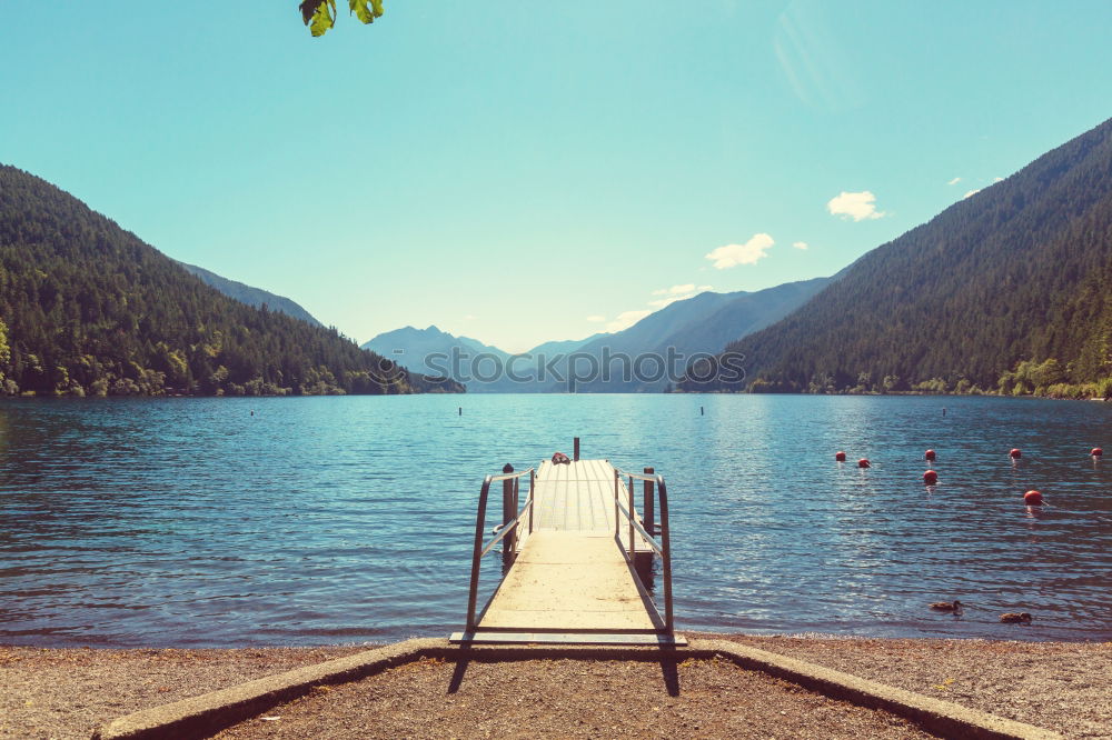 Similar – Image, Stock Photo Wooden footbridge at Silsersee with mountains in the background