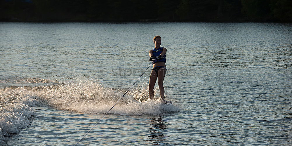 Similar – the jumper Girl Lake