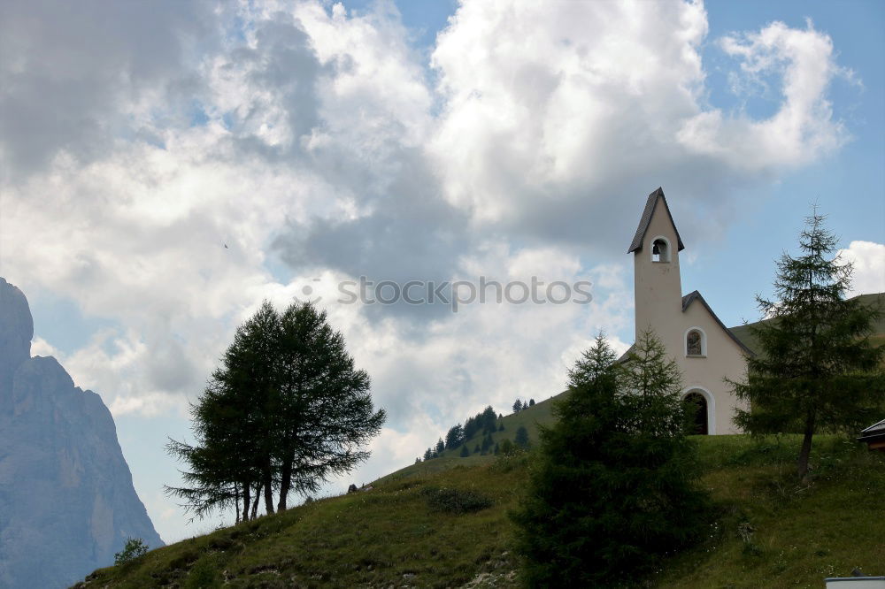 Church tower in front of foggy landscape