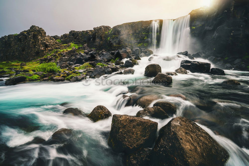 Similar – River flowing in mountains