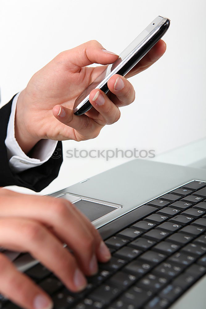 Similar – Woman hands using smartphone and writing notebook