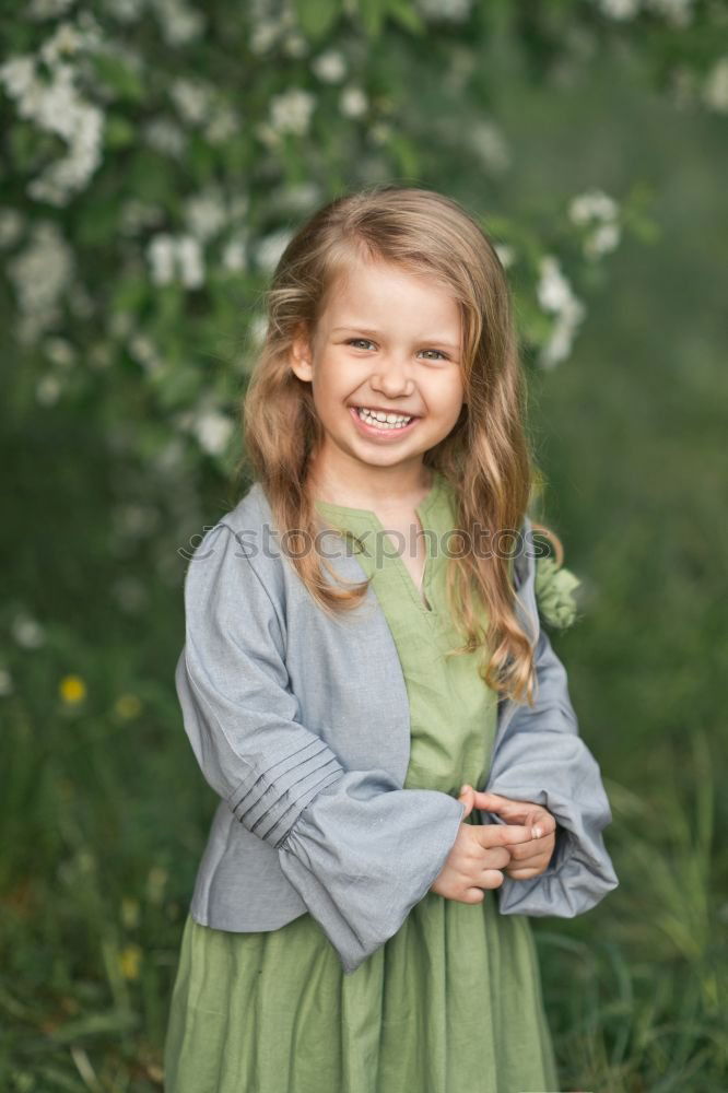 Similar – Image, Stock Photo Smiling girl between meadow with dry leaves