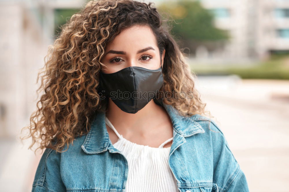 Similar – Young woman in medical mask standing near blooming flowers