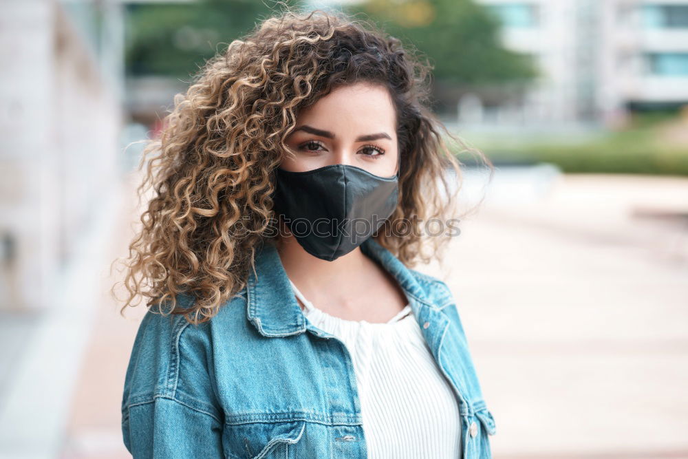 Similar – Young woman in medical mask standing near blooming flowers