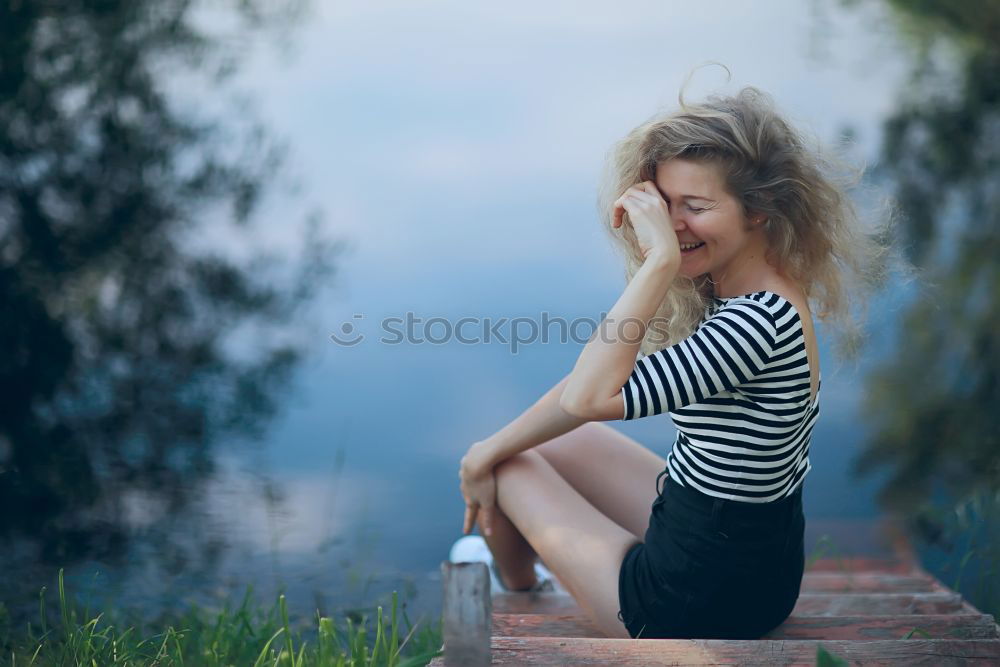 Similar – Image, Stock Photo Happy woman sitting on urban background sunbathing