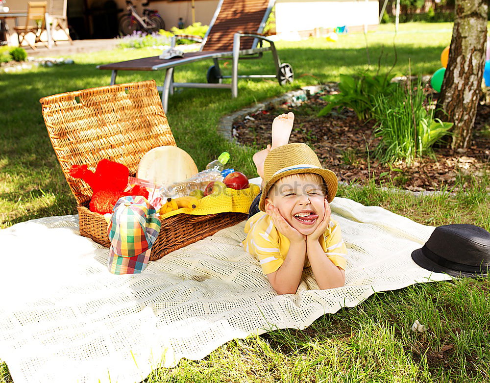 Similar – Image, Stock Photo Two happy children lie on a hammock and play with soap bubbles.