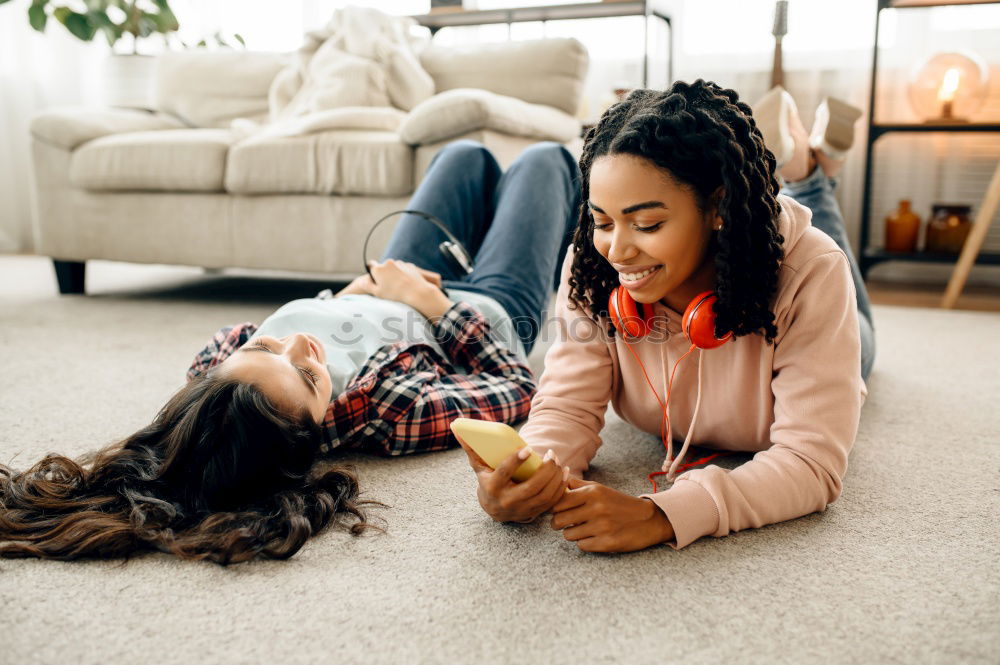 Similar – Happy mom and daughter using digital tablet together