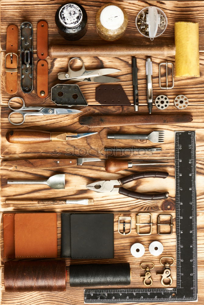 Similar – Cracking nuts with different tools, arranged next to crushed walnuts