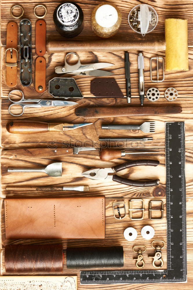 Similar – Cracking nuts with different tools, arranged next to crushed walnuts