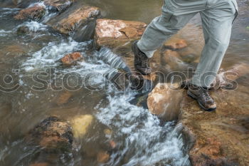 Similar – Image, Stock Photo Legs in leather boots in puddle