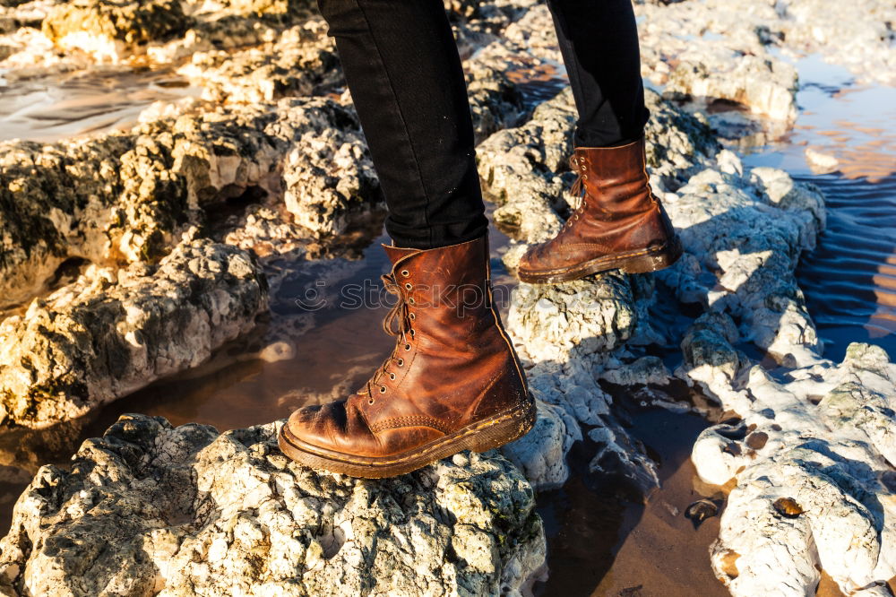 Similar – Image, Stock Photo Legs in leather boots in puddle