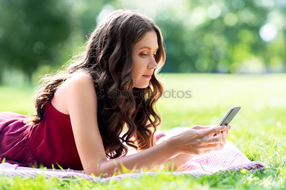 Similar – Image, Stock Photo Woman skateboarder listening music from smart phone in a park