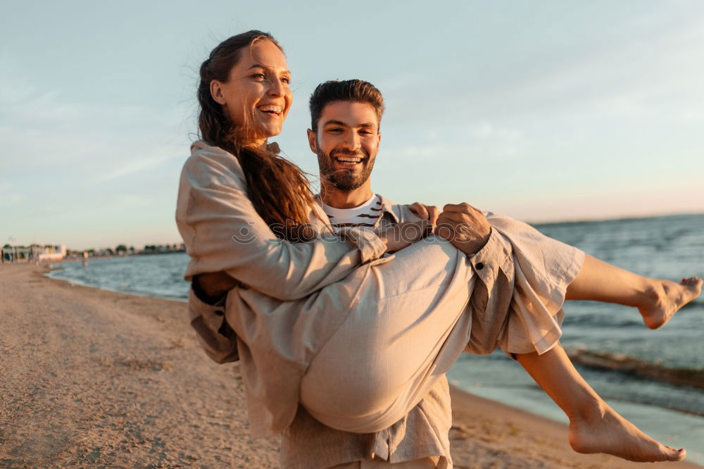 Similar – Image, Stock Photo Happy young adult couple with cute puppy