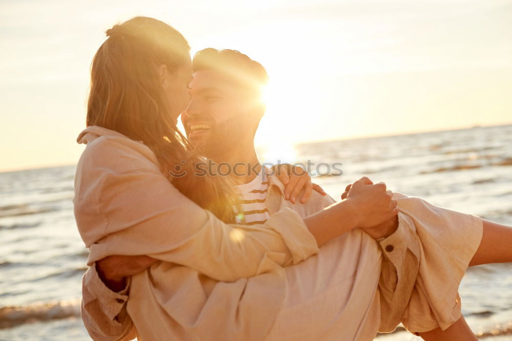 Unrecognizable couple walking embracing together