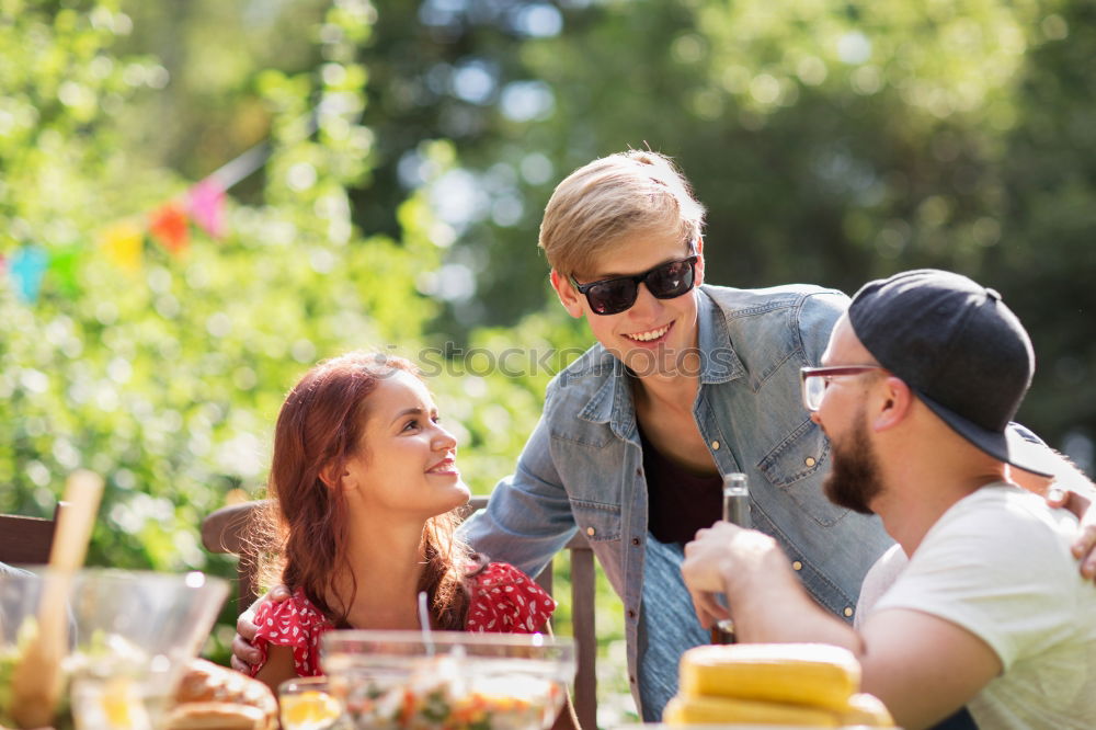 Similar – Cute young adult couple taking photo at outdoor picnic