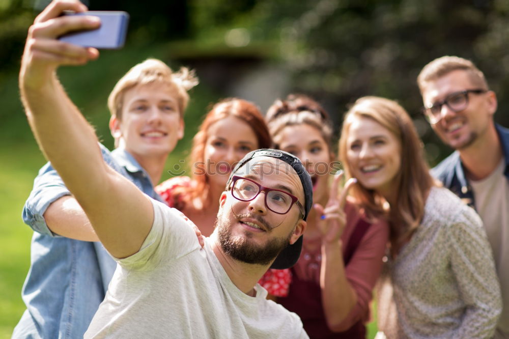 Similar – Group of friends taking selfie in urban park