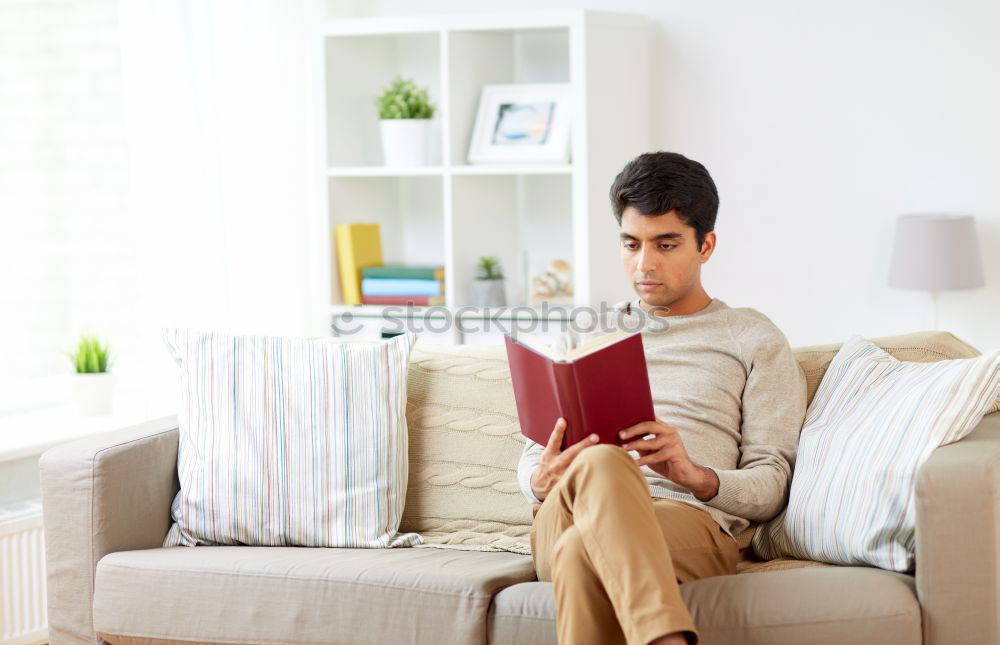 Similar – black woman reading on a sofa