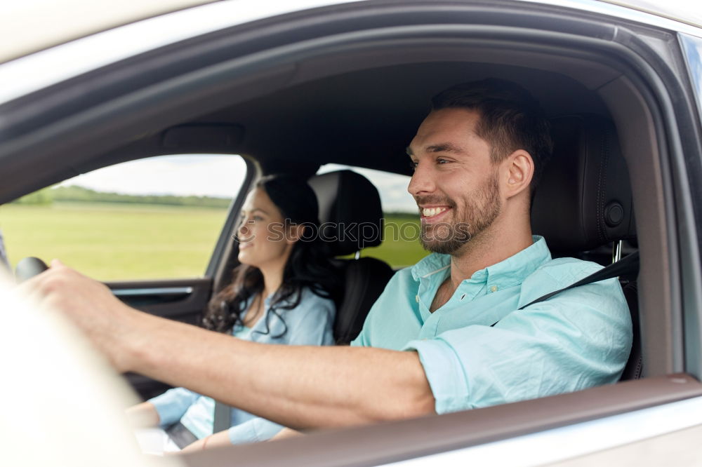 Similar – father teaching kid daughter to drive a car