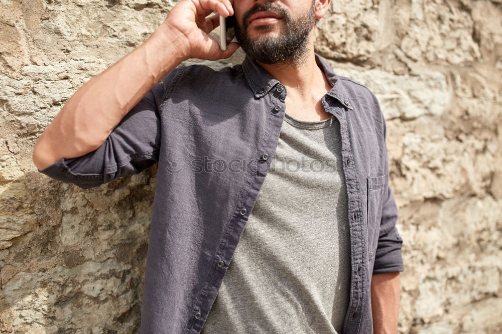 Similar – Portrait of a mature man sitting on steps in the street