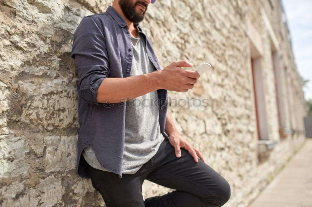 Similar – Man sitting in a bench on a beautiful maroon background