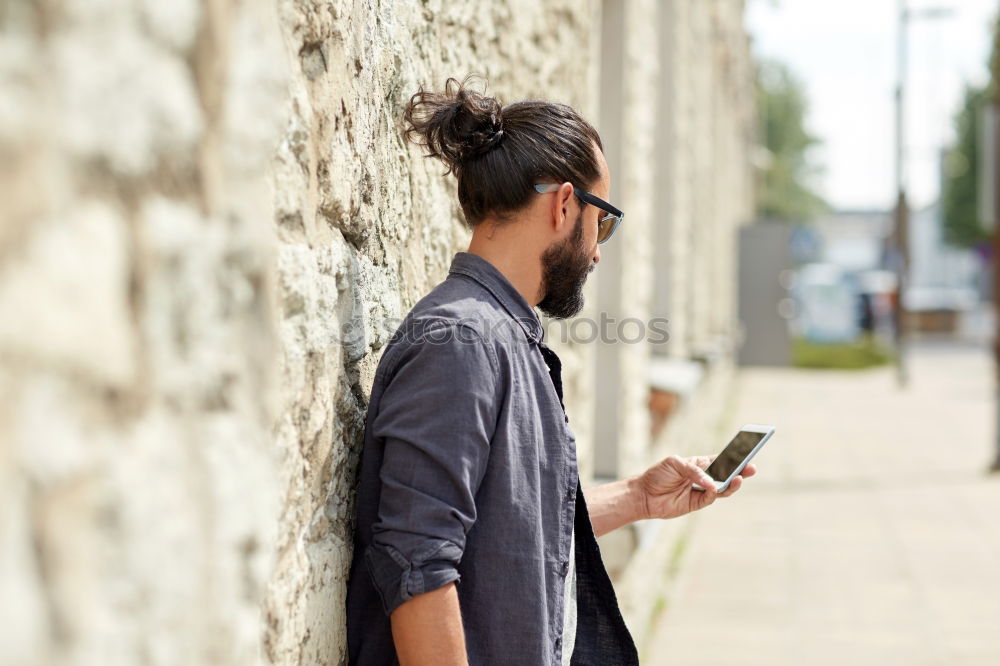 Similar – Traveler using smartphone on city