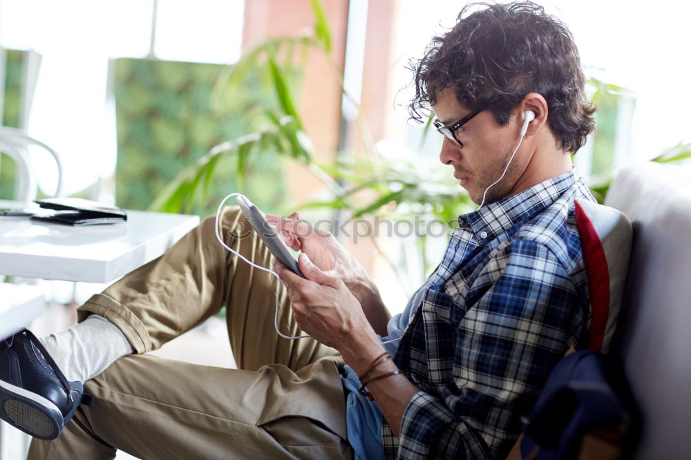 Similar – Man listening music in train