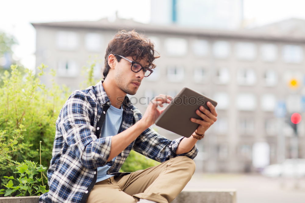 Similar – Image, Stock Photo young boy looking at tablet pc computer with frustrated look on his face